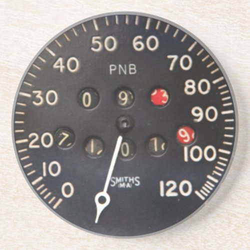 Old speedometer gauge from a vintage race car drink coaster
