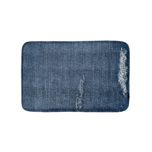 Old torn denim: jeans texture. bath mat