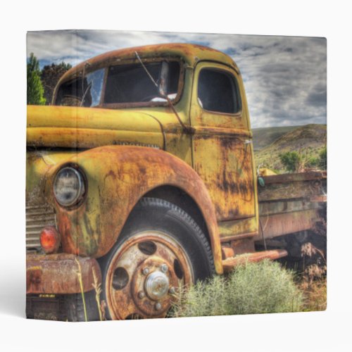 Old truck abandoned in field binder