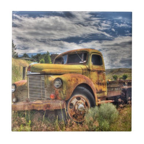 Old truck abandoned in field tile