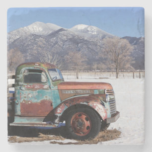 Old truck sitting in the field stone coaster