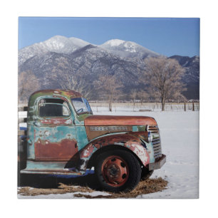 Old truck sitting in the field tile