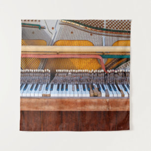 Old vintage piano with the lid off. A dilapidated Tapestry