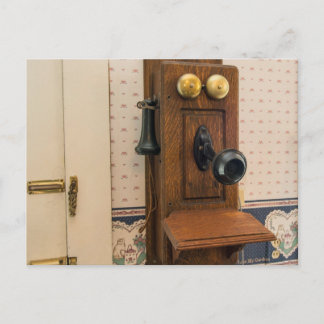 Old vintage wall telephone. postcard