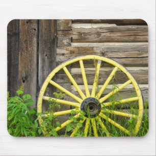 Old wagon wheel in historic old gold town mouse pad
