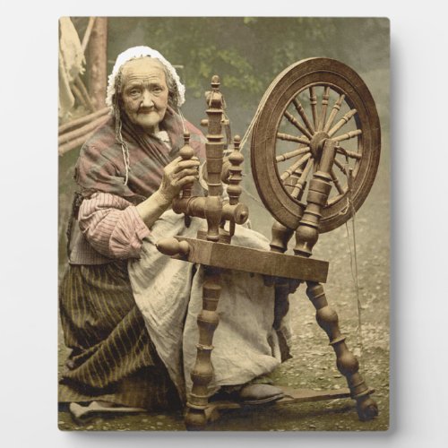 Old Woman With Spinning Wheel Plaque