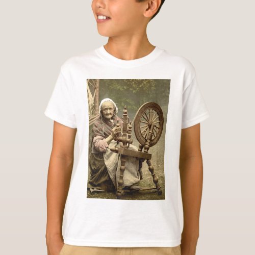 Old Woman With Spinning Wheel T_Shirt