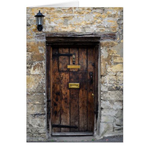 Old wooden front door with light