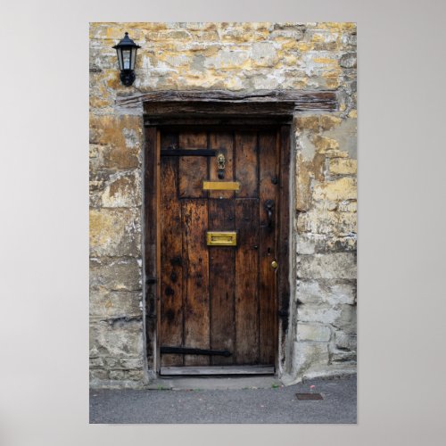 Old wooden front door with light poster