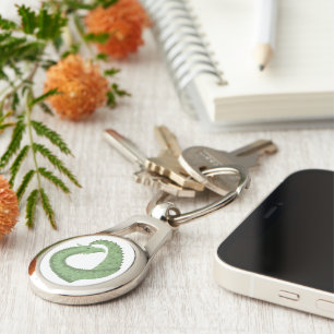 Olive green heart dragon on white keychain