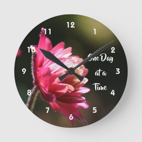 One Day At A Time Quote Flower In Sunlight   Round Clock