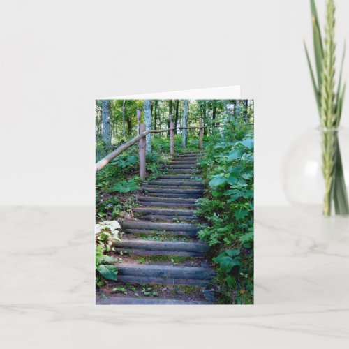 One step at a time up a log staircase holiday card
