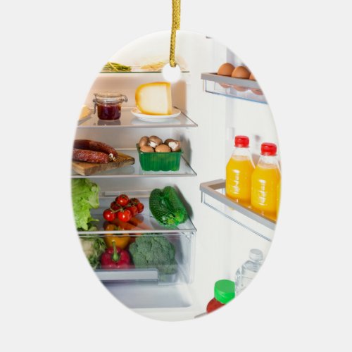 Open fridge filled with food ceramic ornament