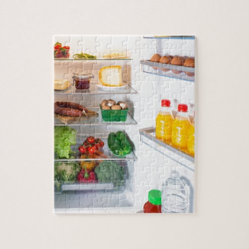 Open fridge filled with food jigsaw puzzle