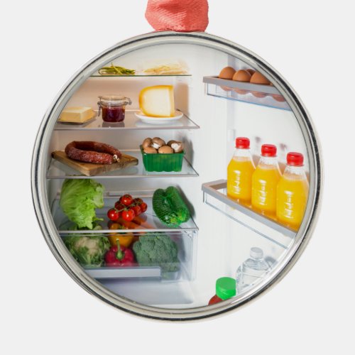 Open fridge filled with food metal ornament