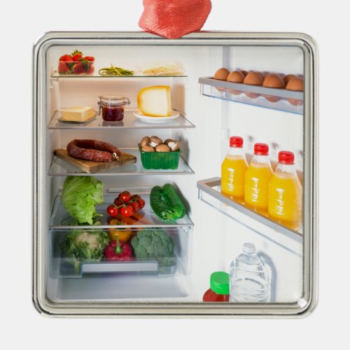Open fridge filled with food metal ornament