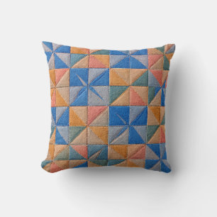 orange and blue quilt throw pillow