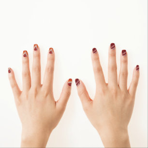 orange and burgundi fluid minx nail art