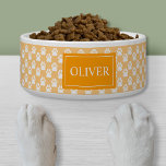 Orange And White Dog Paws With Pet's Name Bowl<br><div class="desc">This pet bowl has a pattern of white dog paw prints on a light orange background color. There is also an orange banner with a customizable text area for pet's name.</div>