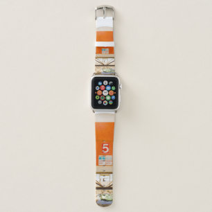 Orange and white shed in front of shore apple watch band