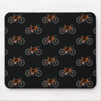 orange bicycle on black mouse pad