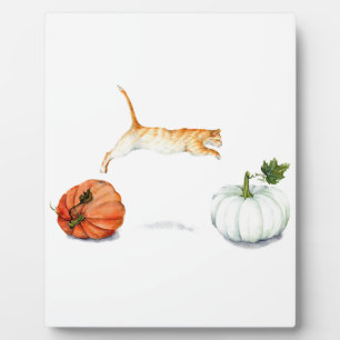 Orange Cat Jumping Between Pumpkins Plaque