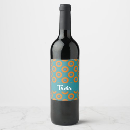 Orange circles on blue wine label