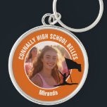Orange Color Guard Photo High School Dancer Keychain<br><div class="desc">This cool customized high school color guard photo gift features white typography of your team and dancer name on an orange keychain with a silhouette of a girl leaping and flag spinning. Personalize with your student's photograph and class year as a proud parent.</div>