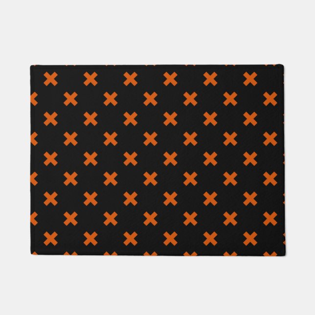 Orange cross stitches on black doormat (Front)