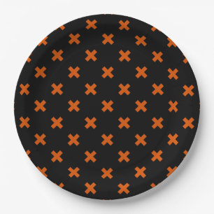 Orange cross stitches on black paper plates