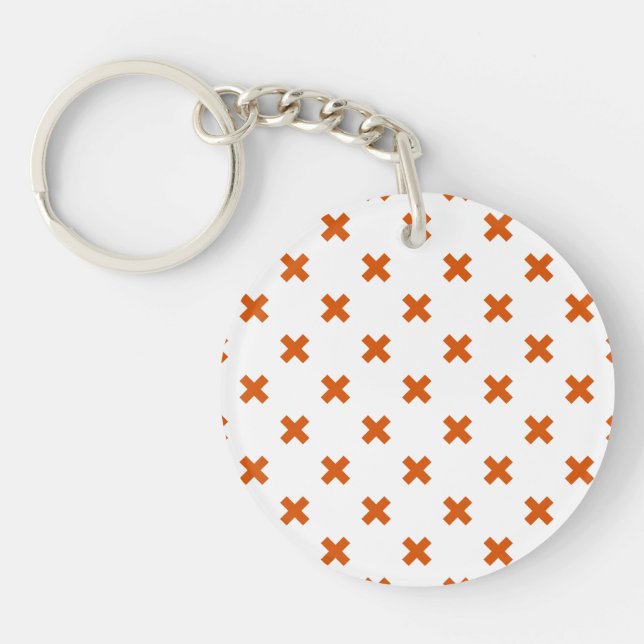 Orange cross stitches on white keychain (Front)