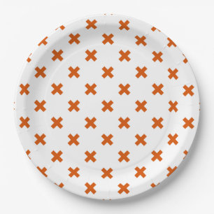 Orange cross stitches on white paper plates