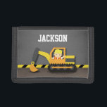 Orange Excavator Construction Builder Boy Trifold Wallet<br><div class="desc">A cute little builder boy in a safety hat and bright orange vest driving an orange, yellow and grey excavator at a construction site! There is a yellow and black slanted stripes for the background which is usually found in construction zones and sites! The design is treated with a shadow...</div>