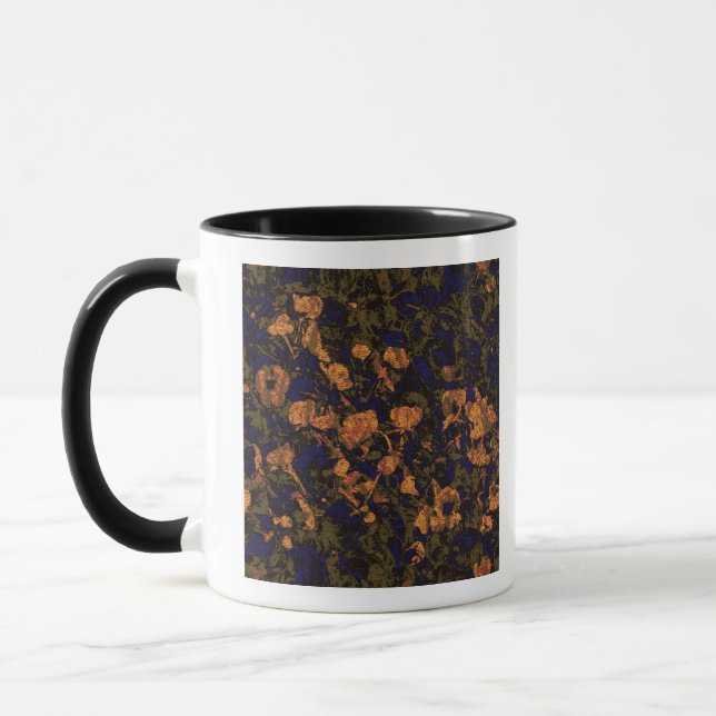 Orange flower against leaf camouflage pattern mug (Left)