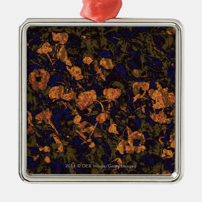 Orange flower against leaf camouflage pattern christmas ornament