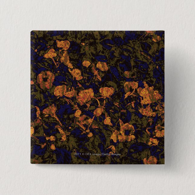 Orange flower against leaf camouflage pattern pinback button (Front)