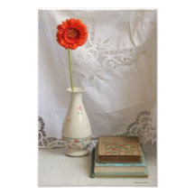 Orange gerbera and books