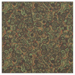 orange green brown and black abstract fabric