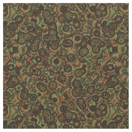 orange green brown and black abstract fabric