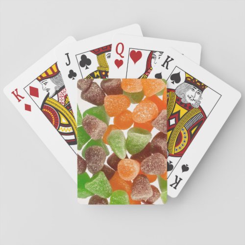 Orange green red gum candy sprinkled with sugar playing cards