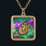 Orange monarch butterfly photo purple flower bold gold plated necklace<br><div class="desc">A close-up photo of a delicate, orange and black monarch butterfly resting on a bright magenta flower. Explore thoughts of warm, sunny days whenever you wear this stunning, colorful photography charm necklace. This necklace comes in small, medium and large sizes, as well as both square and circle shapes. You can...</div>