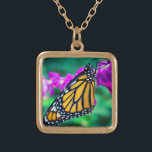 Orange monarch butterfly photo purple flower bold gold plated necklace<br><div class="desc">A close-up photo of a delicate, orange and black monarch butterfly resting on a bright magenta flower. Explore thoughts of warm, sunny days whenever you wear this stunning, colorful photography charm necklace. This necklace comes in small, medium and large sizes, as well as both square and circle shapes. You can...</div>