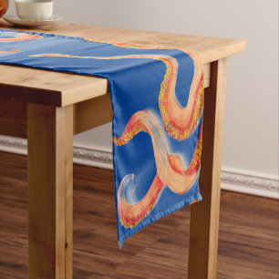 orange octopus on blue short table runner
