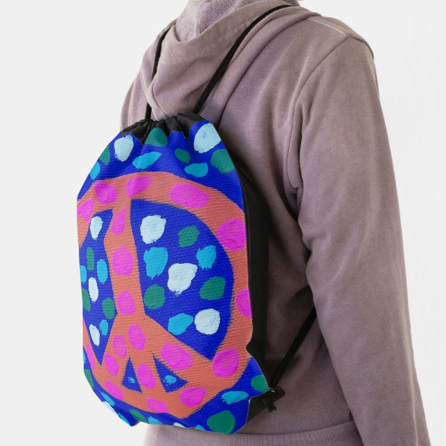 Orange Peace Symbol on Blue   Drawstring Bag (Insitu)