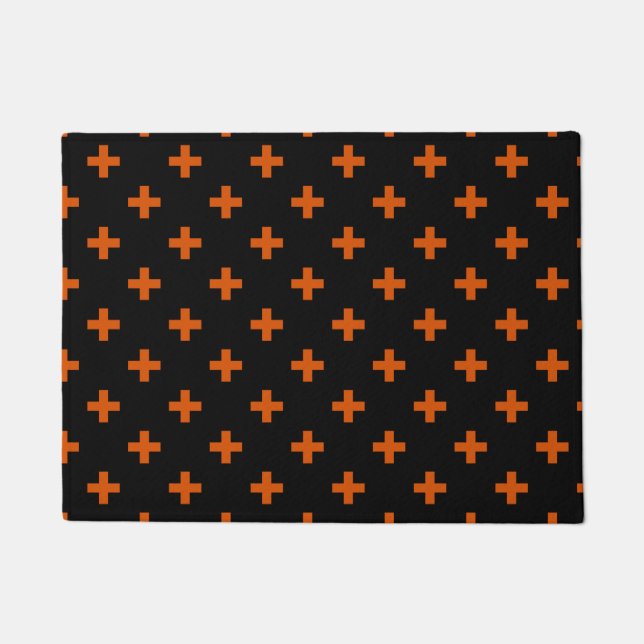 Orange polka crosses on black doormat (Front)