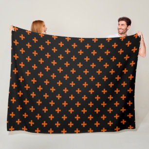 Orange polka crosses on black fleece blanket