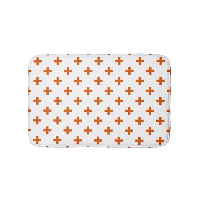 Orange polka crosses on white bath mat (Front)