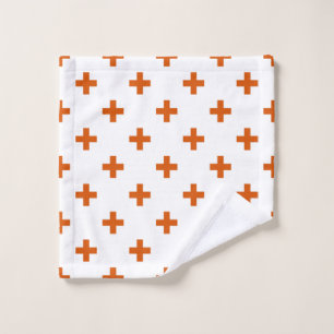 Orange polka crosses on white wash cloth