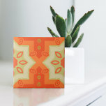 Orange Red Green Modern Ethnic Moroccan Pattern Ceramic Tile<br><div class="desc">This ceramic tile features a vibrant and symmetrical design, characterized by its geometric shapes and warm color palette. The central motif is a bold, orange X-shaped pattern adorned with eye-shaped elements in a lighter shade of orange. These shapes are accentuated by green outlines and circles, creating an intricate and harmonious...</div>
