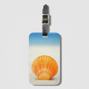 Orange Scallop Shell Standing Upright In Sand Luggage Tag